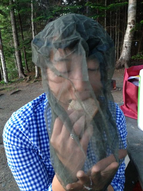 Mica wearing gnat bag